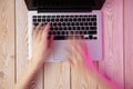 Image of womanÃ¢â¬â¢s hands typing fast on laptop keyboard. View from above. Remote work concept image Royalty Free Stock Photo